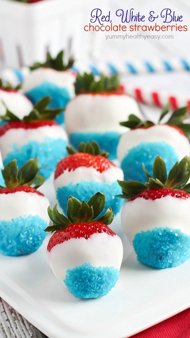 Red, White, & Blue Chocolate Covered Strawberries on a white plate.