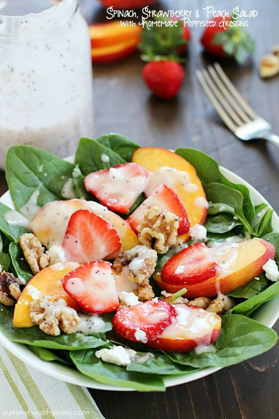 Spinach Salad with strawberries, peaches, candied walnuts, goat cheese and a crazy good (and crazy easy) homemade poppyseed dressing! 