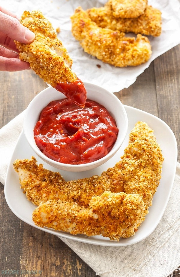 Healthy, gluten free chicken tenders with a crispy almond meal crust are an easy to make and healthy dinner. Serve them with sweet, smoky, spicy chipotle ketchup for the perfect dipping sauce!