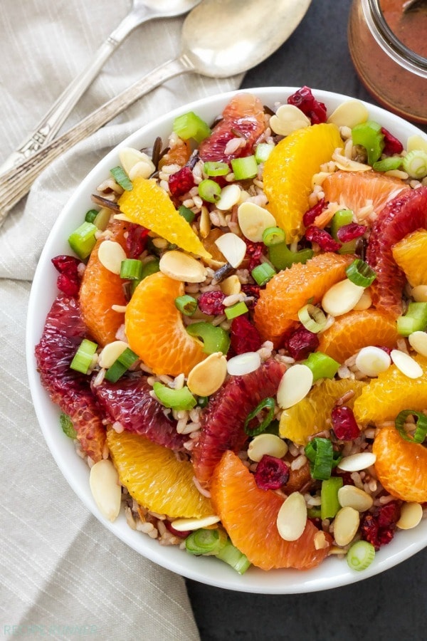 This Citrus and Wild Rice Salad is full of healthy whole grain wild rice, loads of citrus, crunchy toasted almonds, dried cranberries and a delicious citrus vinaigrette. A must-make!