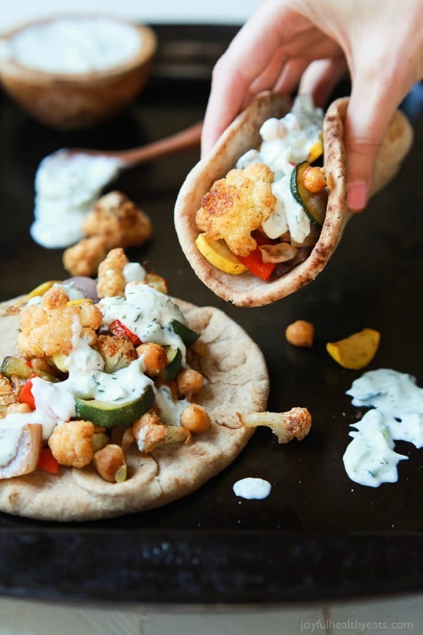 Moroccan Cauliflower Chickpea Pita – done in 35 minutes, filled with spiced roasted vegetables and covered in a creamy Tzatziki Sauce. A meal your family will love and perfect for meatless Monday!