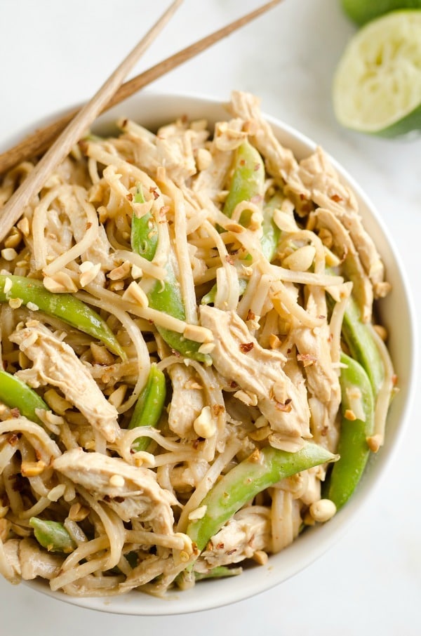 Pressure Cooker Thai Peanut Chicken & Noodles - lean chicken breasts are cooked in a homemade spicy Thai peanut sauce and finished off with rice noodles and peas for an easy and healthy one-pot meal!