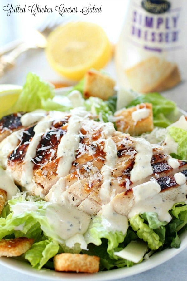 Grilled Chicken Caesar Salad – with a simple marinade recipe, this grilled chicken is tender and delicious! Served over romaine, shaved parmesan, homemade croutons & caesar dressing.