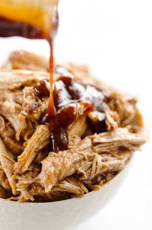 Pressure Cooker BBQ Pulled Pork is an easy three ingredient recipe made in your Instant Pot! This tender and delicious pork is perfect for sandwiches or wonderful paired with rice and vegetables for a healthy dinner idea.