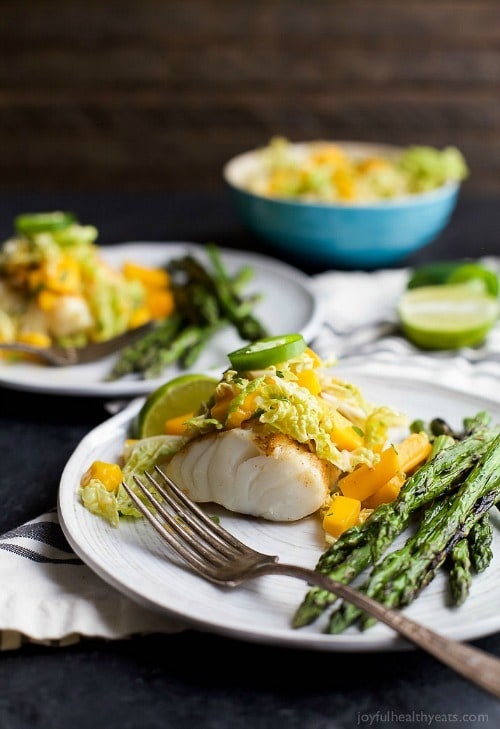 Grilled White Fish topped with a refreshing Mango Jalapeno Coleslaw that will blow more than your socks off! Incredible flavor, minimal ingredients with less than 20 minutes to prepare!