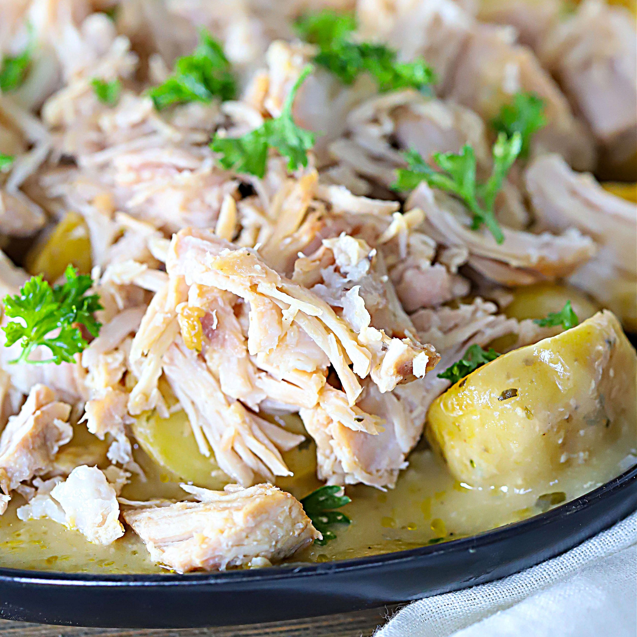 Golden potatoes topped with tender pork chops and parsley.