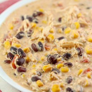 Throw this Crock Pot Cream Cheese Chicken Chili recipe into your slow cooker in the morning and you'll have a delicious chili dinner your whole family will love! My family's favorite creamy chili!