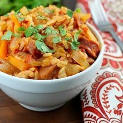 Crock Pot Skinny Chicken Jambalaya! Low calorie, tastes great and fills you up! Using lean proteins, (sliced chicken breasts and turkey sausage) sliced up onions and bell peppers, and rice mix and cooking it all in the slow cooker, makes this jambalaya recipe super easy. So tasty and with few ingredients!
