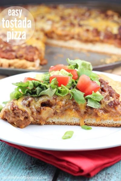 Easy Tostada Pizza is a fun cross between a taco, pizza and a tostada! Yummy, quick & easy dinner for any night of the week!