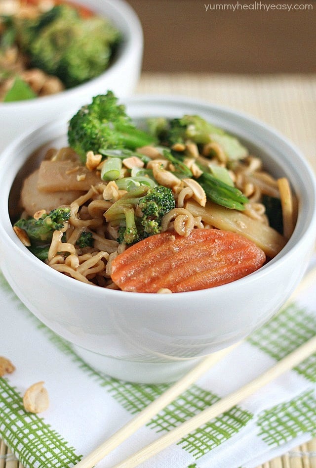 A new spin on ramen noodles - Chicken Thai Noodle Bowls! Ramen noodles and stir-fry veggies tossed in a quick & easy peanut sauce and topped with chopped peanuts and green onions. Bye bye boring ramen!