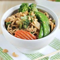 A new spin on ramen noodles - Chicken Thai Noodle Bowls! Ramen noodles and stir-fry veggies tossed in a quick & easy peanut sauce and topped with chopped peanuts and green onions. Delicious!