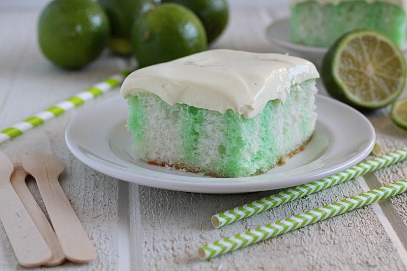 Skinny Lime Poke Cake recipe made using a white cake mix, two egg whites and diet lemon-lime soda. Then it's poked and poured over with sugar-free lime Jell-o and spread with a creamy pudding topping!