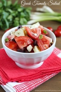 Greek Tomato Salad | easy salad made with tomatoes, cucumbers, olives, green onions & feta cheese and tossed with a homemade dressing. Light and delicious!