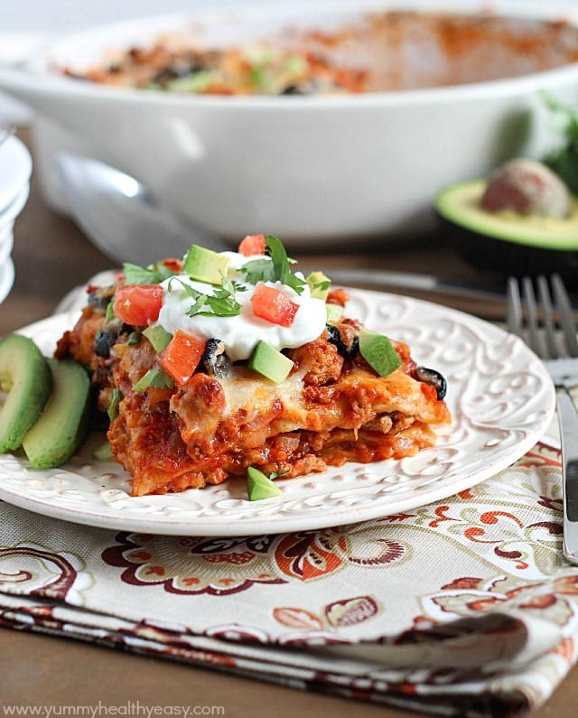 Love enchiladas but hate filling and rolling up all those tortillas? This Enchilada Casserole is all the yummy, cheesy goodness of enchiladas but in an easy casserole form!