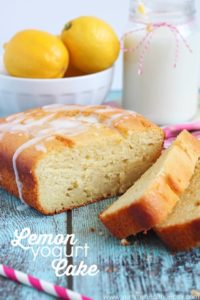 Lemon cake sliced with a glaze drizzled over the top.
