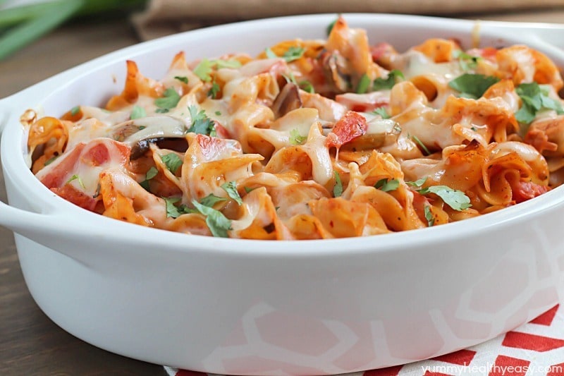 A delicious casserole with chicken, mushrooms, tomatoes and egg noodles tossed in a flavorful sauce made using enchilada sauce and OPA Greek Yogurt Ranch Dressing. Best casserole EVER!
