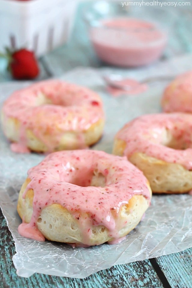 Baked Donuts made with refrigerated biscuits and drizzled with easy and delicious strawberry glaze!