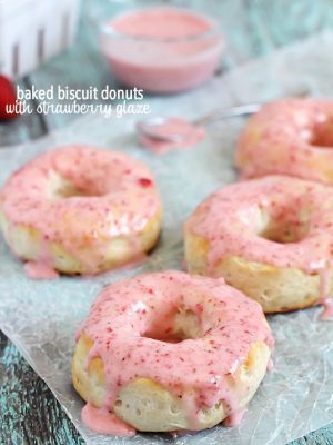 Baked Donuts made with refrigerated biscuits and drizzled with easy and delicious strawberry glaze!