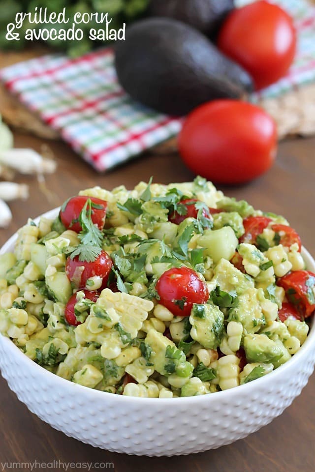 Delicious grilled corn mixed together with avocado, tomato, feta, green onions, cilantro and cucumber then tossed in an easy dressing. The perfect refreshing side dish for a BBQ!