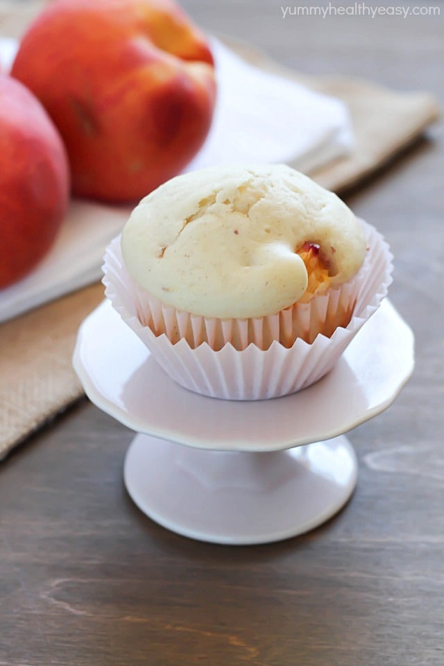 These peach muffins are filled with chunks of delicious peach chunks.  It's the best breakfast or snack!  #breakfast #muffins #peach via @jennikolaus