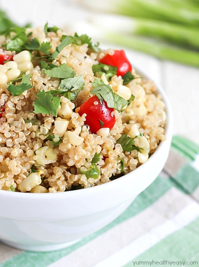Quinoa Salad full of healthy quinoa, grilled corn, cherry tomatoes, cilantro and spices. Delicious!