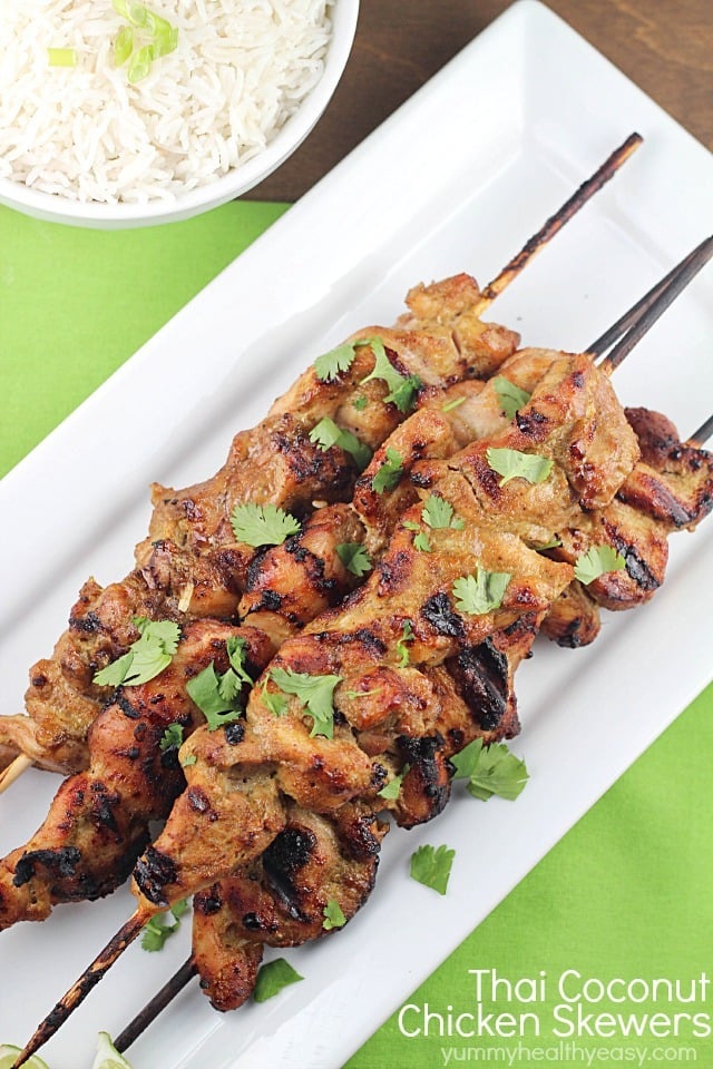 Marinated and grilled Thai Coconut Chicken Skewers over a bed of delicious coconut rice! 