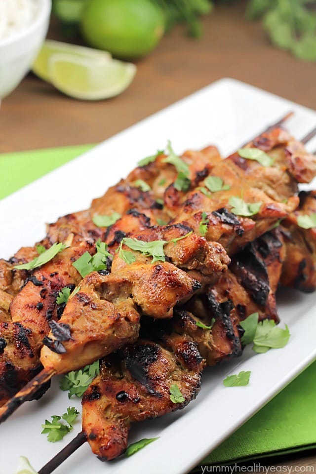 Marinated and grilled Thai Coconut Chicken Skewers over a bed of delicious coconut rice! 