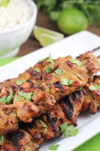 Marinated and grilled Thai Coconut Chicken Skewers over a bed of delicious coconut rice!