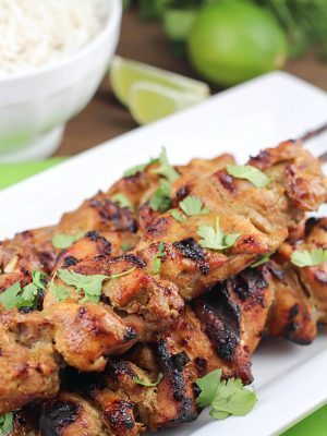 Marinated and grilled Thai Coconut Chicken Skewers over a bed of delicious coconut rice!