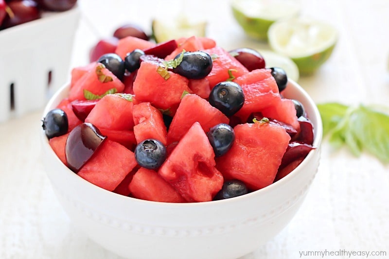 Watermelon Fruit Salad with cherries, blueberries and a delicious mint-lime dressing. Easy, fresh and the perfect summer side dish!