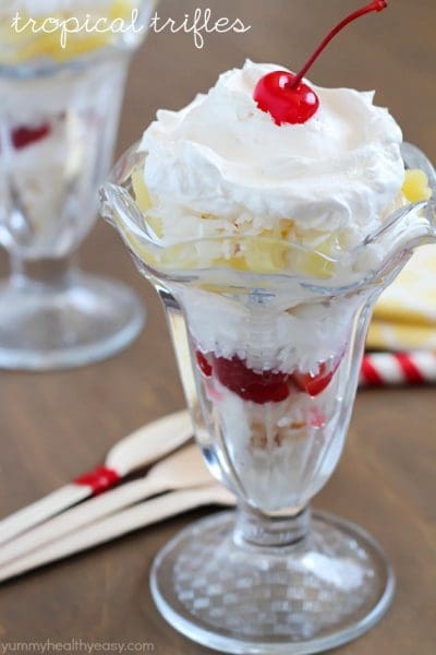 Tropical Trifle - layers of angel food cake, strawberries, pineapple, coconut, cream of coconut & topped with whipped cream! So tasty!