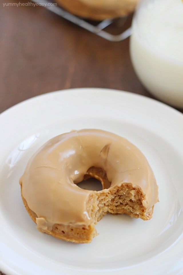 These Baked Apple Donuts with Maple Glaze are seriously the best baked donuts ever! Moist, apple-spiced flavor dipped in the tastiest maple glaze known to man. And only 196 calories per donut! 