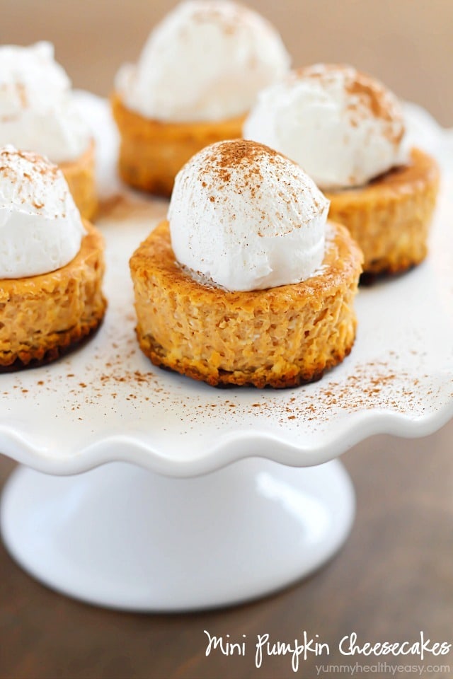Perfect single-size Mini Pumpkin Cheesecakes full of soft, creamy, pumpkin yumminess and less than 160 calories per cheesecake! Best fall dessert yet! 