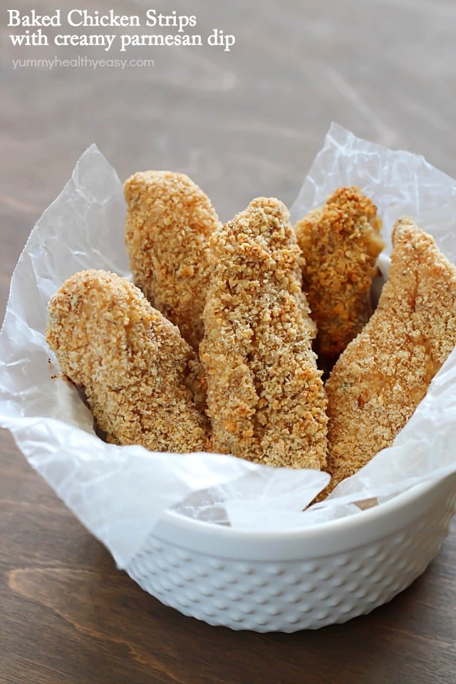 Baked Chicken Strips with Creamy Parmesan Dip - healthier, breaded and baked chicken strips dipped in a creamy parmesan dip.