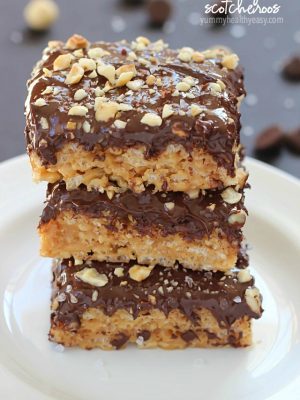 A layer of peanut butter Rice Kripsie treats topped with a layer of dark chocolate, hazelnuts and a little bit of sea salt. These scotcheroos will knock your socks off!