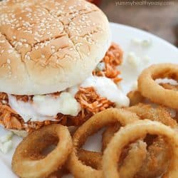 You will love these 3-ingredient Crock Pot Buffalo Chicken Sandwiches! Shredded buffalo chicken inside buns and smothered with blue cheese and hot sauce. So easy and absolutely delicious!