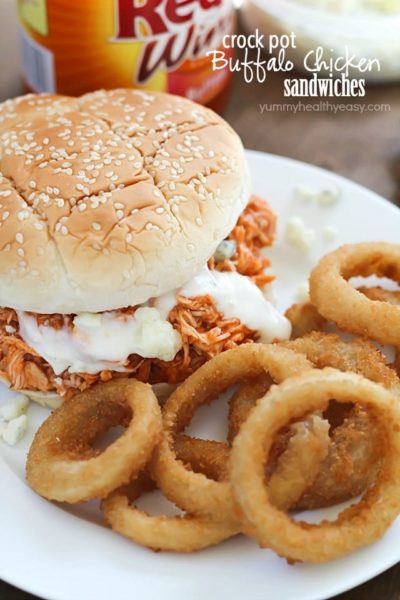 You will love these 3-ingredient Crock Pot Buffalo Chicken Sandwiches! Shredded buffalo chicken inside buns and smothered with blue cheese and hot sauce. So easy and absolutely delicious!