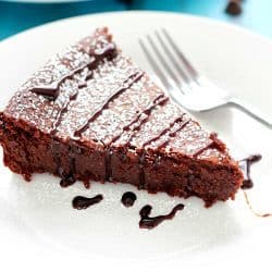 Flourless Chocolate Cake is made with a secret ingredient instead of flour... ;) The most incredible moist, fudgy, decadent cake that's incredibly light and crumbly all at the same time! Perfect Valentine's Day dessert! #truvia