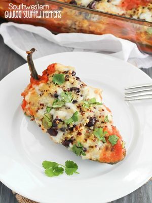 Southwestern Quinoa Stuffed Peppers Recipe - pasilla peppers filled with black beans, quinoa and spices then cooked in a flavorful tomato sauce. Vegetarian, gluten free, clean-eating and absolutely delicious!