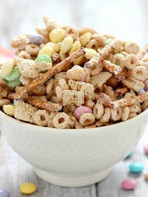 Super delicious and easy Bunny Bait aka Easter Snack Mix. Made with cereal, pretzels, peanuts, pastel M&M candies and white chocolate - perfect for Easter!