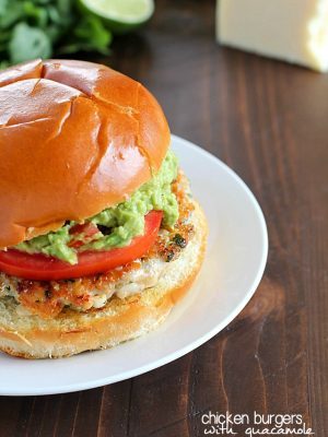 The juiciest, most delicious, guacamole chicken burgers! Super simple to make - serve on buns with a layer of guacamole on the top. Amazing!
