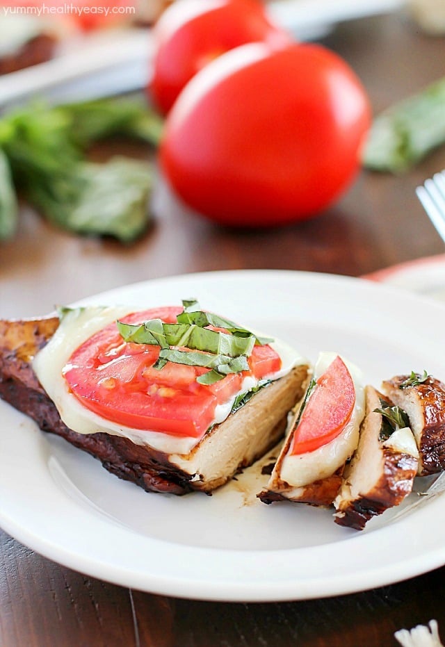 Easy Balsamic Chicken recipe with a caprese twist! Chicken breasts are cooked until tender in a flavorful balsamic sauce then topped with mozzarella, basil & tomato. Low carb and gluten free!