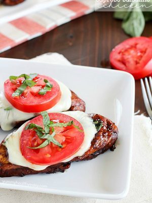 Easy Balsamic Chicken recipe with a caprese twist! Chicken breasts are cooked until tender in a flavorful balsamic sauce then topped with mozzarella, basil & tomato. Low carb and gluten free!