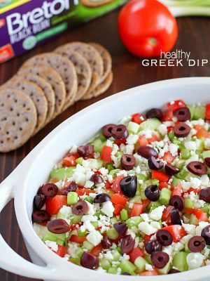 Deliciously healthy greek dip, made with a protein-rich cottage cheese base (with ranch seasonings!) then topped with cucumbers, green onions, tomatoes, kalamata olives, and feta cheese. Healthy and full of flavor! #breton #ad