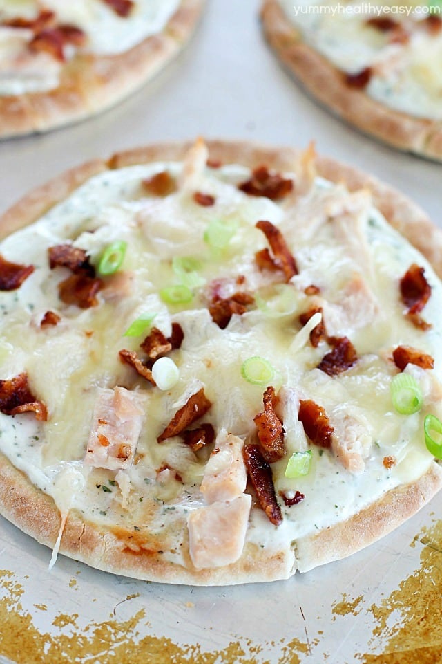 Bacon Ranch Chicken Pita Pizza is topped with ranch dip, chicken, bacon and cheese for a quick and easy lunch, dinner or snack. They have tons of flavor with only a few ingredients and take 30 minutes or less to make! #sponsored #ad