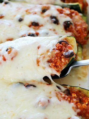 Healthy Black Bean & Quinoa Stuffed Zucchini - a hearty and easy meatless side dish or dinner that's gluten-free and clean-eating. So delicious, you won't even think it's healthy!