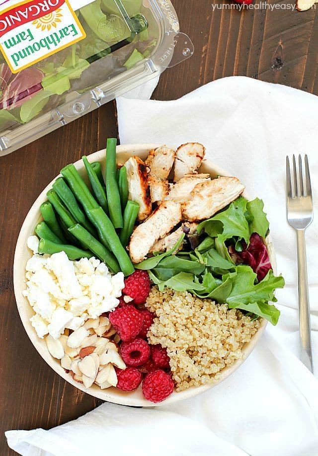 Check out this yummy salad bowl recipe full of grilled chicken, cooked quinoa, kale, raspberries, sliced almonds, feta cheese, green beans and a homemade basil vinaigrette. Super healthy and absolutely delicious! #OrganicBound #Ad