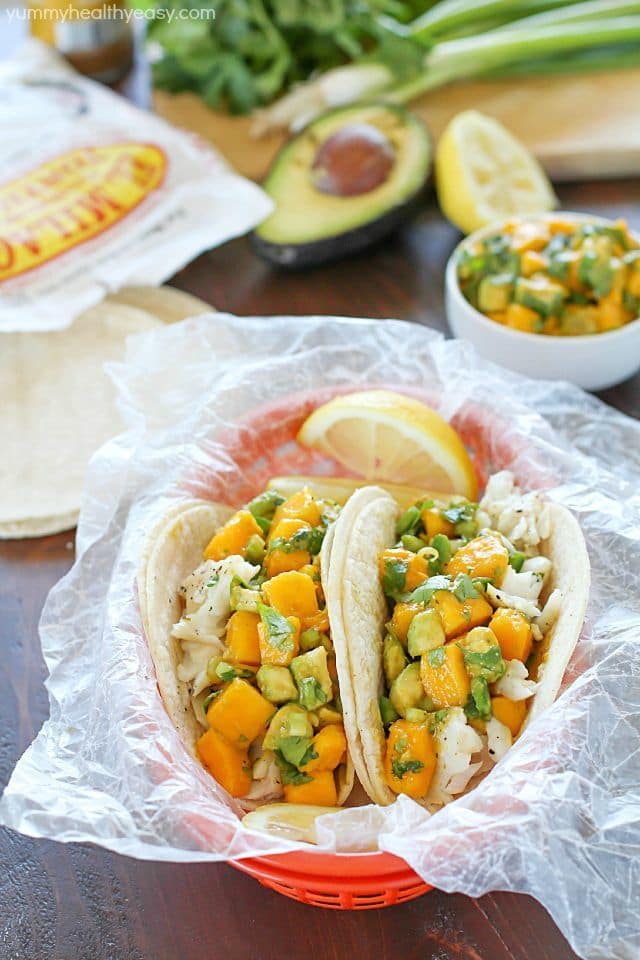 You will love these Fish Tacos with Mango Salsa! Corn tortillas filled with flaky white fish and topped with fresh mango and avocado salsa. Doesn't get better than that! #ad