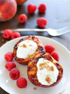 Don't put away that grill after dinner! Throw some peaches on and let them caramelize with brown sugar, then fill them with yogurt. This healthy & easy grilled peaches dessert will blow your mind! #truvia #ad