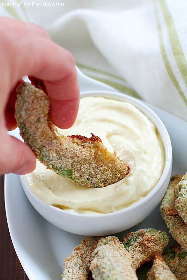 Baked Avocado Fries - these are incredible! Dip them in a homemade garlic aioli and you'll be in heaven. All dairy-free and delicious, must-make healthy recipes! #MeatlessMondayNight